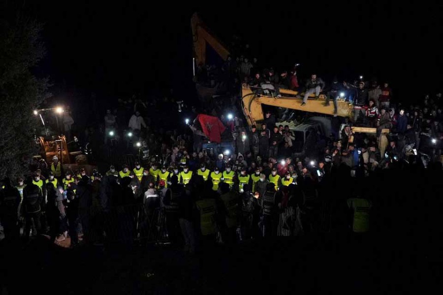 People gather during the rescue operation of 5-year-old child, Rayan Awram, who has been trapped for five days in a well, near Chefchaouen, northern Morocco February 5, 2022, February 5, 2022 –Reuters/Thami Nouas