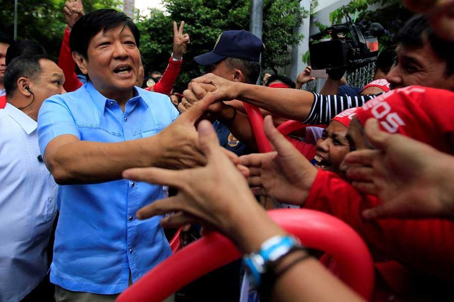 Former senator Ferdinand "Bongbong" Marcos Jr and son of late former dictator Ferdinand Marcos is greeted by his supporters upon his arrival at the Supreme Court in metro Manila, Philippines April 17, 2017 – Reuters/Romeo Ranoco