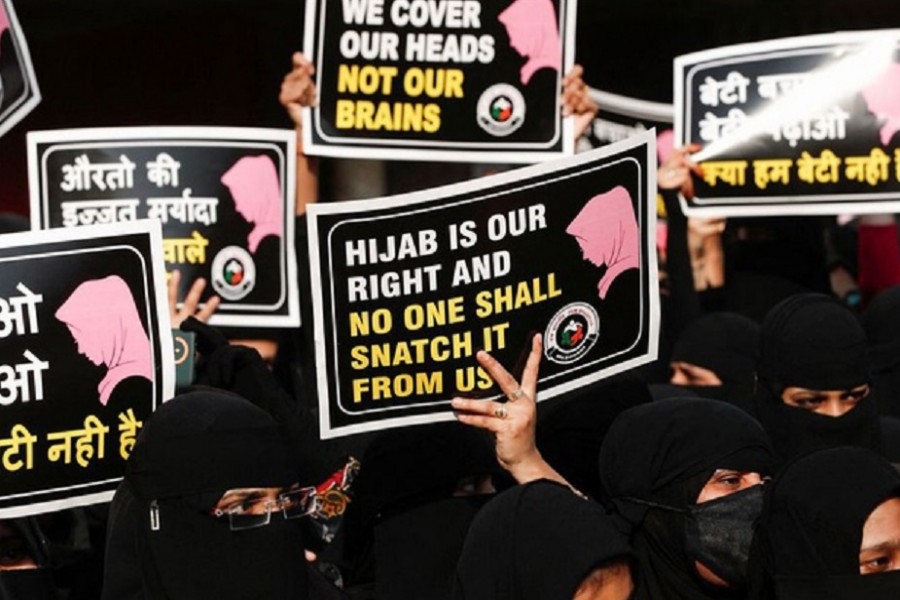 Women hold placards during a protest, organised by Hum Bhartiya, against the recent hijab ban in few colleges of Karnataka state, on the outskirts of Mumbai, India, Feb 11, 2022. Reuters