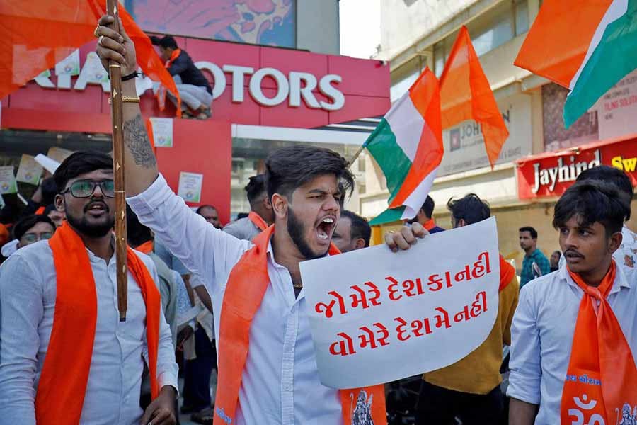 An activist of Bajrang Dal, a Hindu hardline group, shouting slogans in front of a KIA Motors showroom during a protest over their Pakistani partners' tweet in support of Kashmir, in Ahmedabad of India on Saturday –Reuters photo