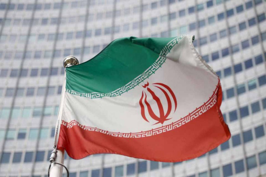 The Iranian flag waves in front of the International Atomic Energy Agency (IAEA) headquarters in Vienna, Austria, March 1, 2021 — Reuters/Lisi Niesner