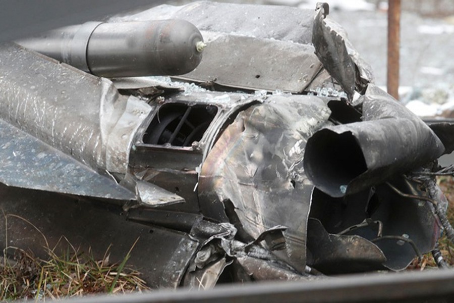 A view shows the remains of a missile that landed in the street, after Russian President Vladimir Putin authorised a military operation in eastern Ukraine, in Kyiv, Ukraine on February 24, 2022