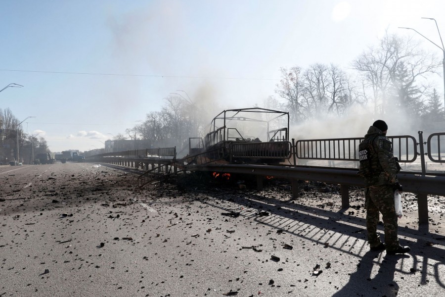 A damaged vehicle is seen at the site of a fighting with Russian raiding troops after Russia launched a massive military operation against Ukraine, in Kyiv, Ukraine February 26, 2022. REUTERS/Valentyn Ogirenko