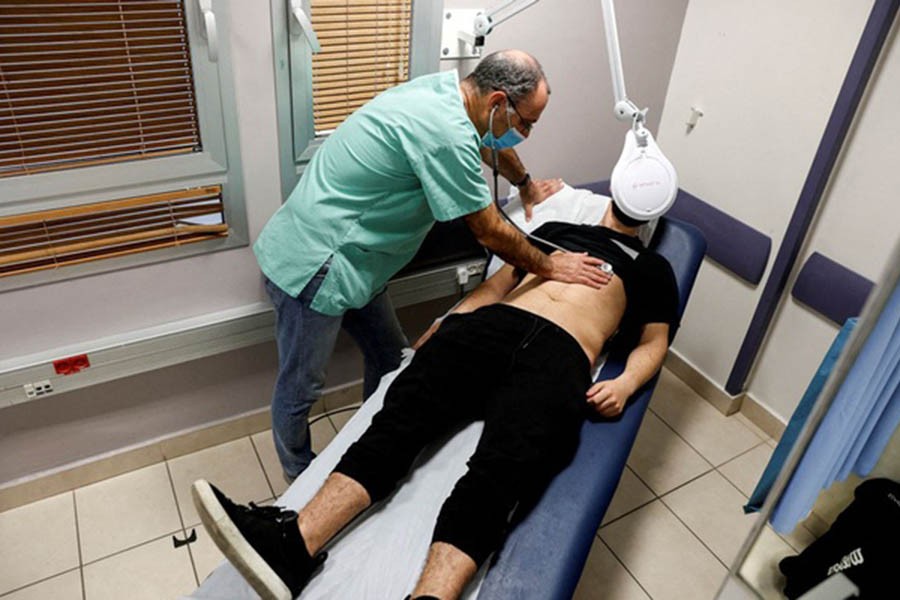 A patient suffering from Long COVID is examined in the post-COVID-19 clinic of Ichilov Hospital in Tel Aviv, Israel, Feb 21, 2022. Reuters