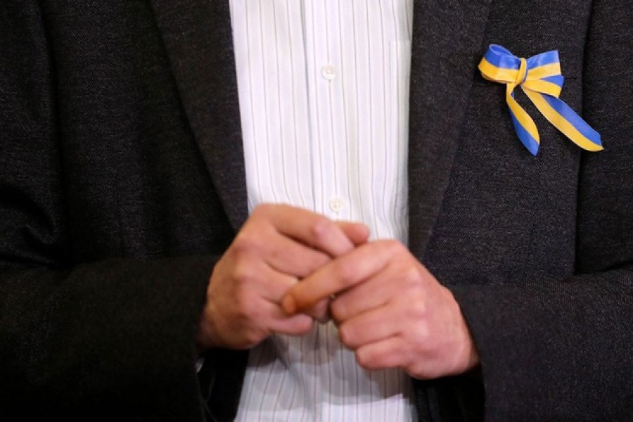 Ukraine's Ambassador to India, Igor Polikha wears a ribbon in the colours of the Ukrainian flag, during a news conference, as Russia's invasion of Ukraine continues, at the Embassy of Ukraine in New Delhi, India, Feb 28, 2022. Reuters