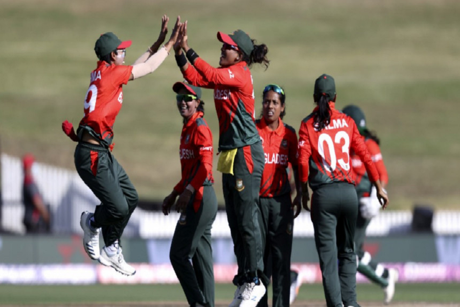 Fahima Khatun (L) and Rumana Ahmed (C) celebrate the wicket of Pakistan's Nida Dar. Photo: AFP