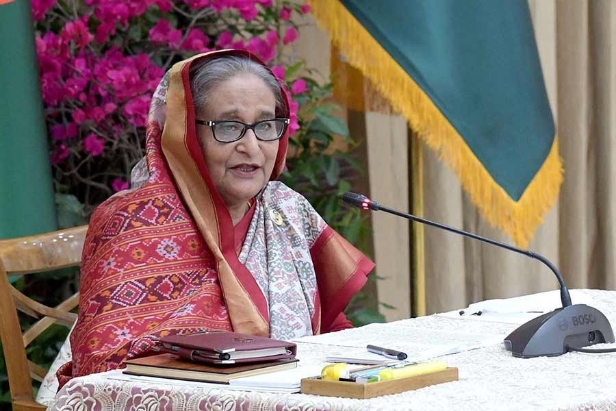 Prime Minister Sheikh Hasina addressing a meeting with the leaders of 14-party alliance at Ganabhaban on Tuesday –PID Photo