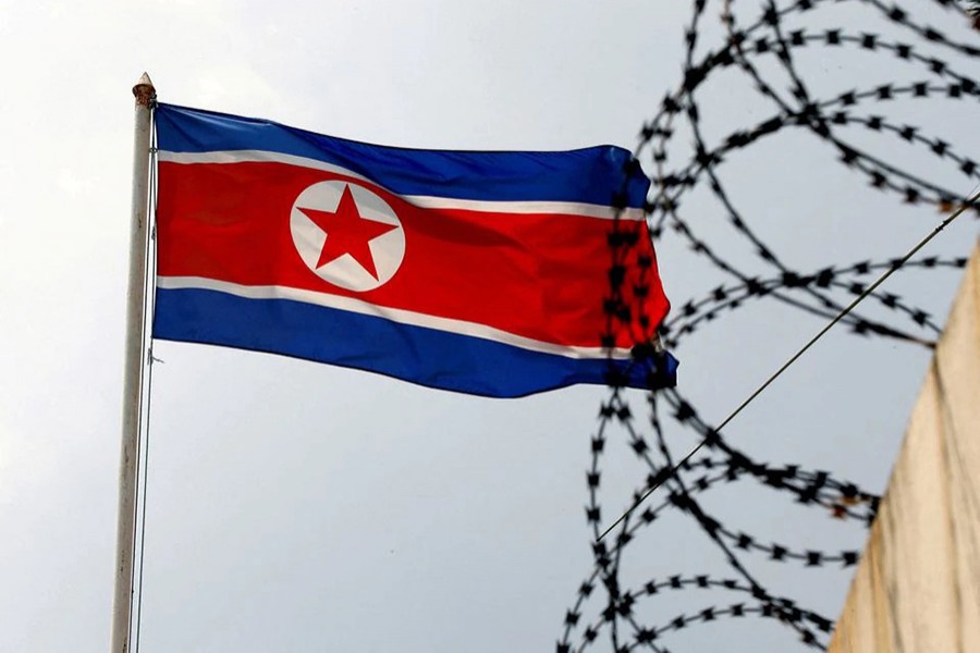 A North Korea flag flutters next to concertina wire at the North Korean embassy in Kuala Lumpur, Malaysia on March 9, 2017 — Reuters/Files