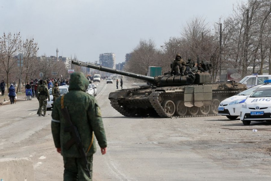 Service members of pro-Russian troops are seen atop of a tank during Ukraine-Russia conflict on the outskirts of the besieged southern port city of Mariupol, Ukraine March 20, 2022. REUTERS/Alexander Ermochenko