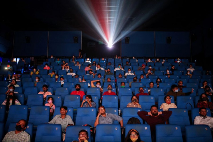 People watch a movie inside a cinema in Mumbai, India, November 5, 2021. REUTERS/Francis Mascarenhas