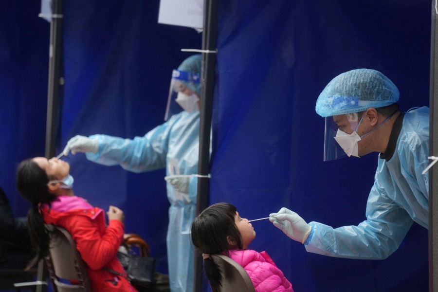 Medical workers take swab samples from residents at a community nucleic acid testing centre for the coronavirus disease (Covid-19) at Sha Tin district, in Hong Kong, China on February 7, 2022 — Reuters/Files