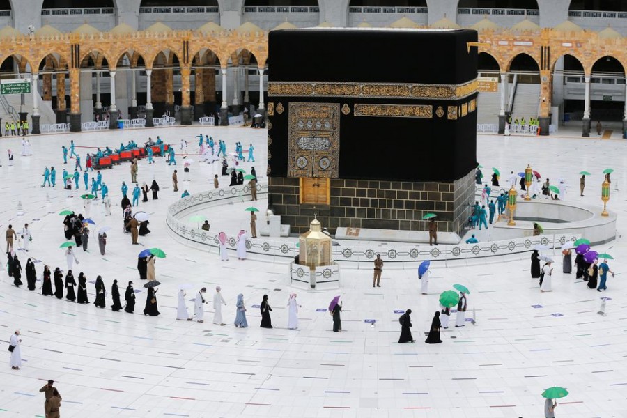 Pilgrims keeping social distance and wearing face masks, perform farewell Tawaf around the holy Kaaba in the Grand Mosque, after completing their extended Haj, "Haj Al Kabeer", during the annual Haj pilgrimage, in the holy city of Mecca, Saudi Arabia, July 22, 2021 – Reuters/Ahmed Yosri