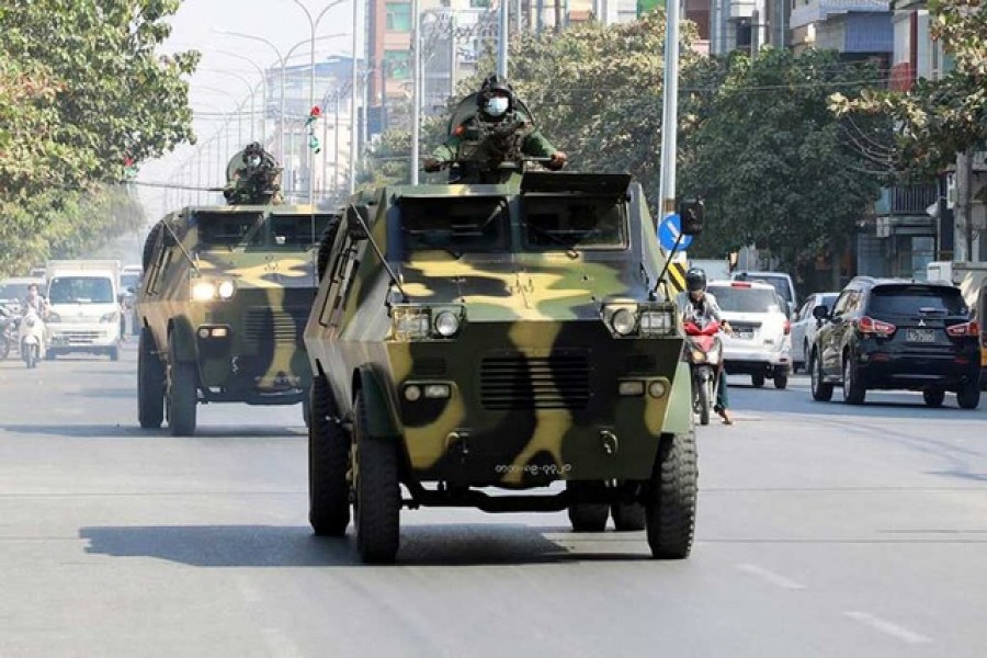 Myanmar Army armored vehicles drive in a street after the military seized power in a coup in Mandalay, Myanmar, February 3, 2022 – Reuters/Stringer