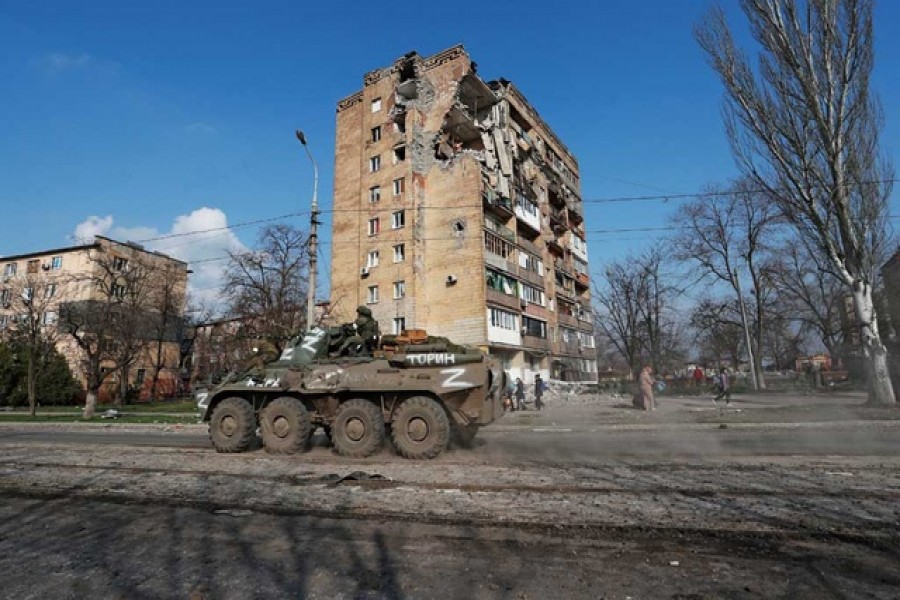 Service members of pro-Russian troops ride an armoured personnel carrier during Ukraine-Russia conflict in the southern port city of Mariupol, Ukraine Apr 15, 2022 – Reuters/Alexander Ermochenko