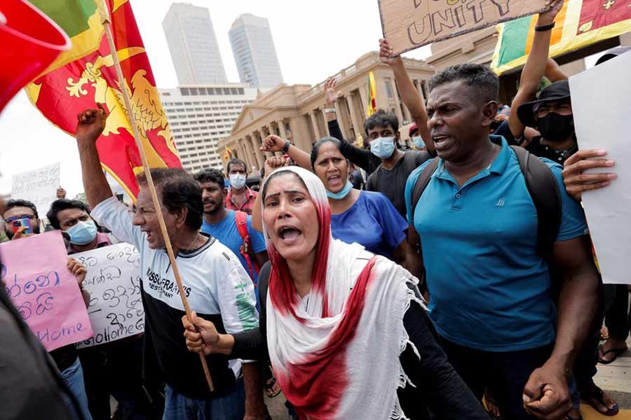 Sri Lankan people chanting slogans during a protest against their President Gotabaya Rajapaksa in front of the Presidential Secretariat building, amid the country's economic crisis, in Colombo –Reuters file photo