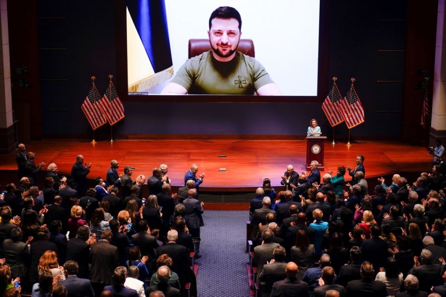 Ukrainian Ambassador to the US Oksana Markarova receives applause as US House Speaker Nancy Pelosi speaks and Ukrainian President Volodymyr Zelenskiy looks on through video, at the US Capitol in Washington, US on March 16, 2022 — Pool via Reuters