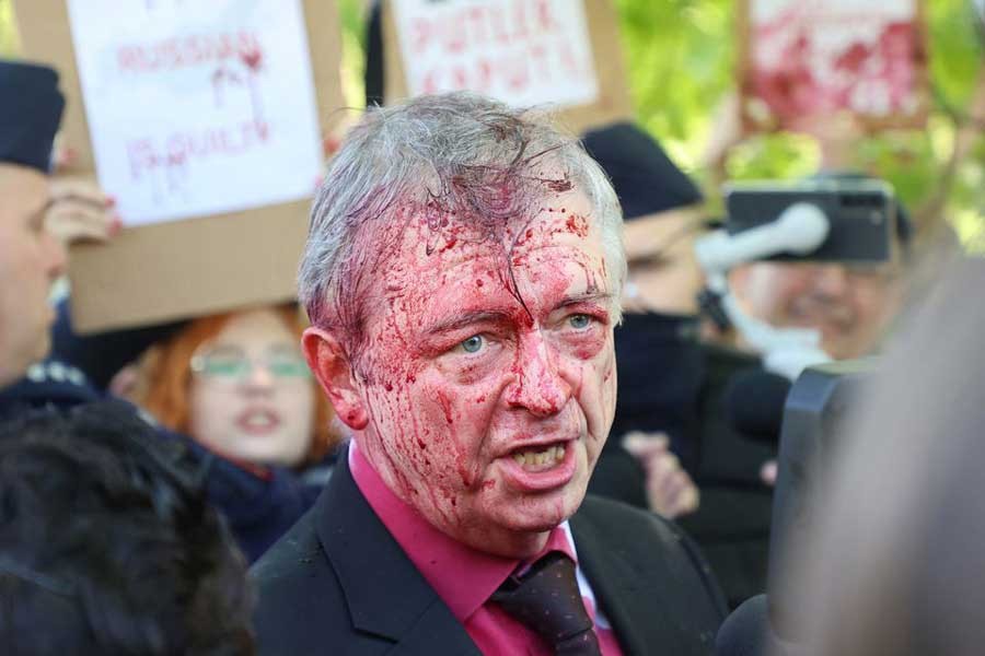 Russia's ambassador to Poland Sergey Andreev is covered in red substance thrown by protesters in Warsaw on Monday as he came to celebrate Victory day at the Soviet Military Cemetery to mark the 77th anniversary of the victory over Nazi Germany –Reuters photo