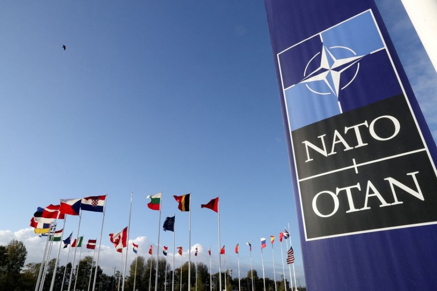 Flags wave outside the Alliance headquarters ahead of a NATO Defence Ministers meeting, in Brussels, Belgium, October 21, 2021. REUTERS/Pascal Rossignol/File Photo