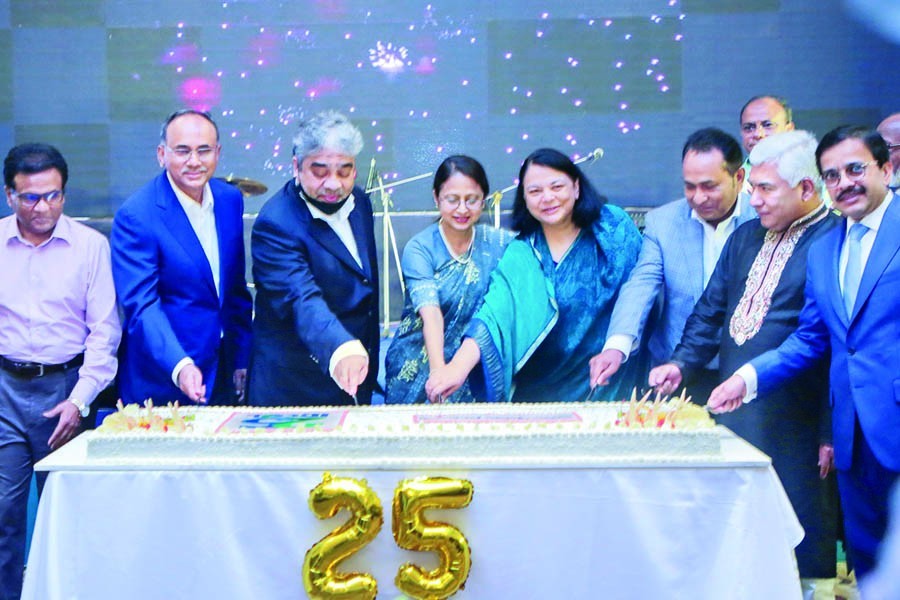 Fatima Yasmin, Chairman of IDCOL, along with the members of the Board of Directors and other guests cuts a cake at a programme celebrating the silver jubilee of IDCOL at a city hotel on Friday