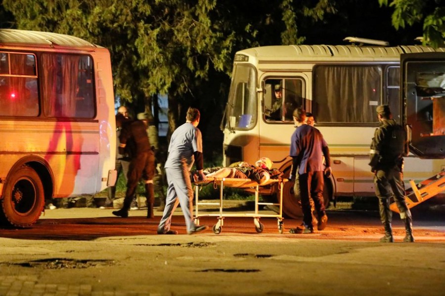 A wounded service member of Ukrainian forces from the besieged Azovstal steel mill in Mariupol is transported on a stretcher out of a bus, which arrived under escort of the pro-Russian military in the course of Ukraine-Russia conflict in Novoazovsk, Ukraine May 16, 2022. REUTERS/Alexander Ermochenko