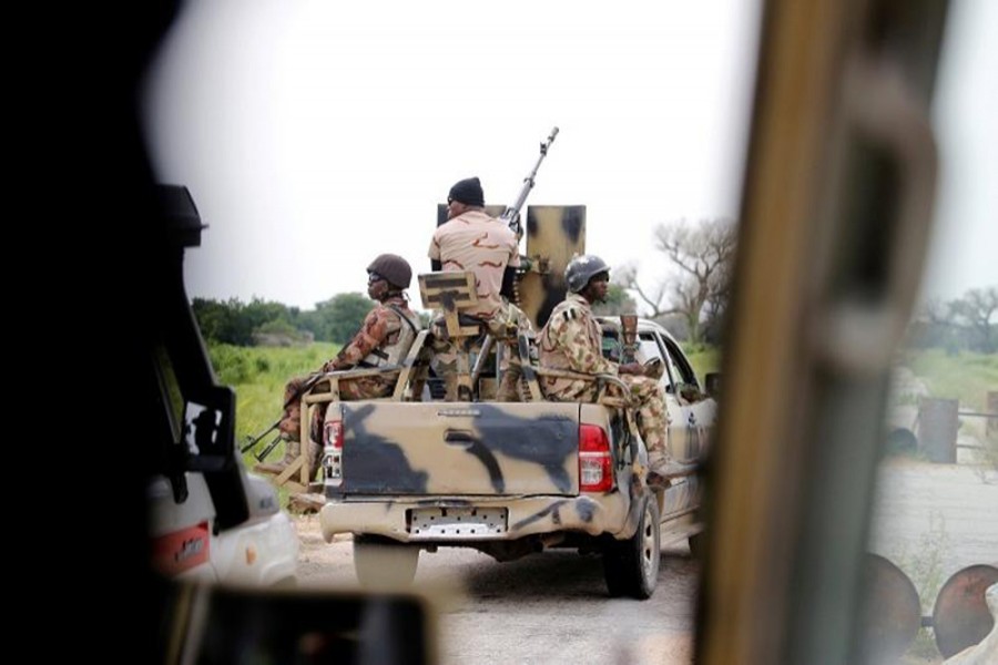 A Nigerian army convoy vehicle drives ahead with an anti-aircraft gun, on its way to Bama, Borno State, Nigeria on August 31, 2016 — Reuters/Files