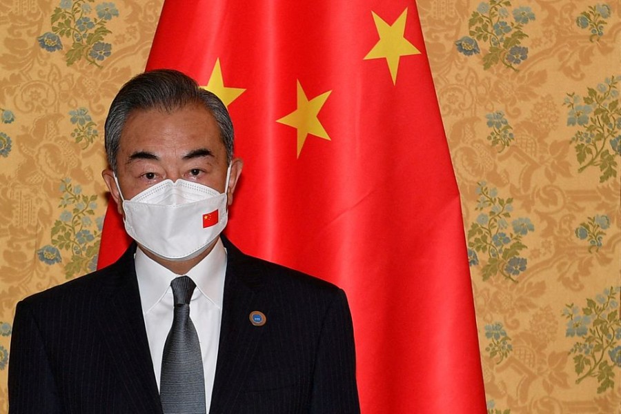 Chinese Foreign Minister Wang Yi poses for a picture prior to meeting U.S. Secretary of State Antony Blinken on the sidelines of the G20 summit in Rome, Italy October 31, 2021. Tiziana Fabi/Pool via REUTERS/File Photo