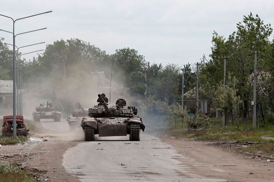 Tanks of pro-Russian troops drive along a street during Ukraine-Russia conflict in the town of Popasna in the Luhansk Region, Ukraine on May 26, 2022 — Reuters photo