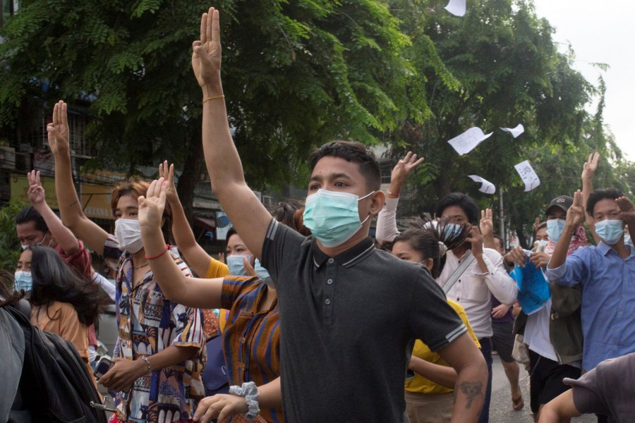 Anti-coup protesters flash the three-finger salute during a flash mob protest in Yangon, Myanmar on June 3, 2021 — Reuters/Files