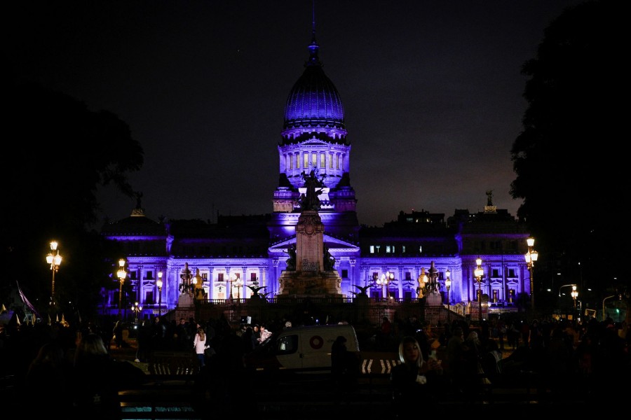 Women of the movement "Not one (woman) less" stand outside the Congress to protest against femicides and gender violence, in Buenos Aires, Argentina June 3, 2022. REUTERS/Mariana Nedelcu