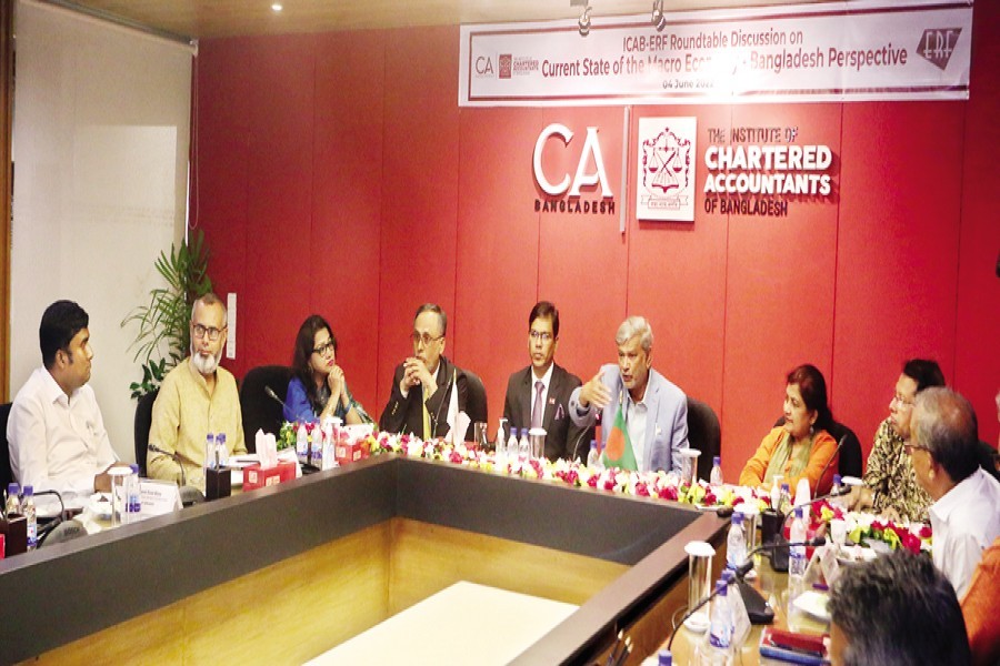 Planning Minister MA Mannan speaks at a roundtable on 'Current State of the Macro Economy: Bangladesh Perspective' at the ICAB Council Room at CA Bhaban in the city on Saturday. The Institute of Chartered Accountants of Bangladesh (ICAB) and the Economic Reporters' Forum (ERF) jointly organised the event. — FE photo