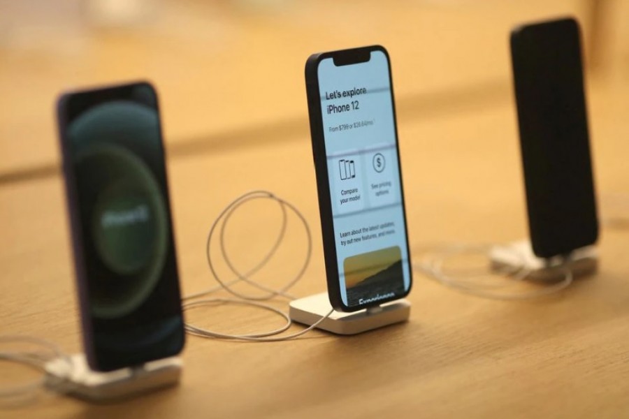 IPhone 12 phones are seen at the new Apple Store on Broadway in downtown Los Angeles, California, US, June 24, 2021. REUTERS/Lucy Nicholson