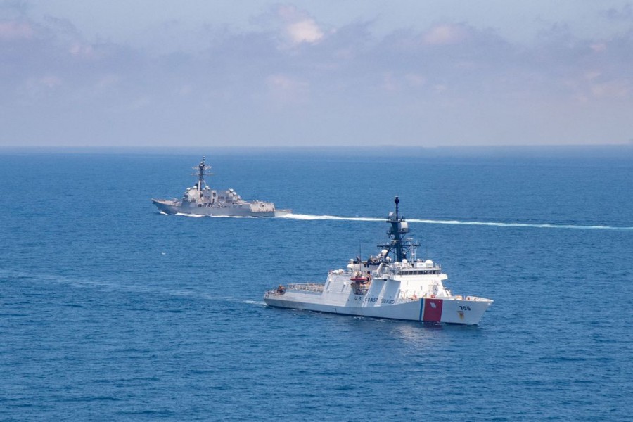 The Arleigh Burke-class guided-missile destroyer USS Kidd and U.S. Coast Guard cutter Munro conduct Taiwan Strait transits August 27, 2021. US Navy/Handout via REUTERS