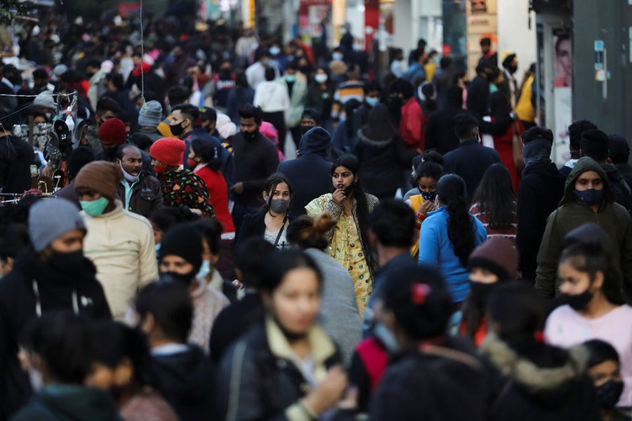 People shop at a market amidst the spread of coronavirus disease (Covid-19) in New Delhi, India on February 4, 2022 — Retuers/Files