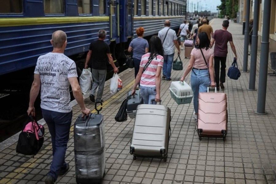 People board a train to Dnipro and Lviv during an evacuation effort from war-affected areas of eastern Ukraine, amid Russia's invasion of the country, in Pokrovsk, Donetsk region, Ukraine June 18, 2022. REUTERS