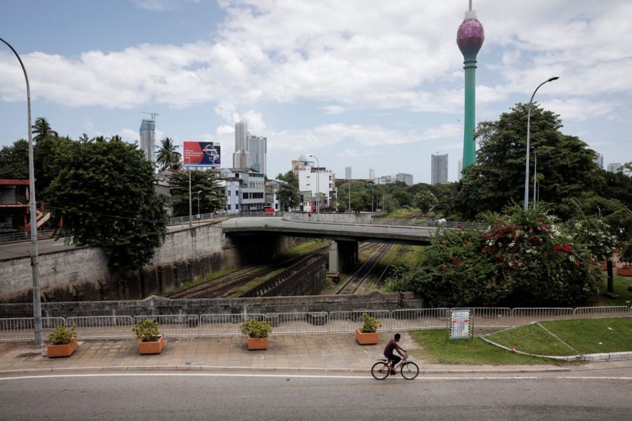 A man rides a cycle along main road as less vehicles are on the road due to fuel shortage, amid the country's economic crisis, in Colombo, Sri Lanka, June 28, 2022. REUTERS/Dinuka Liyanawatte