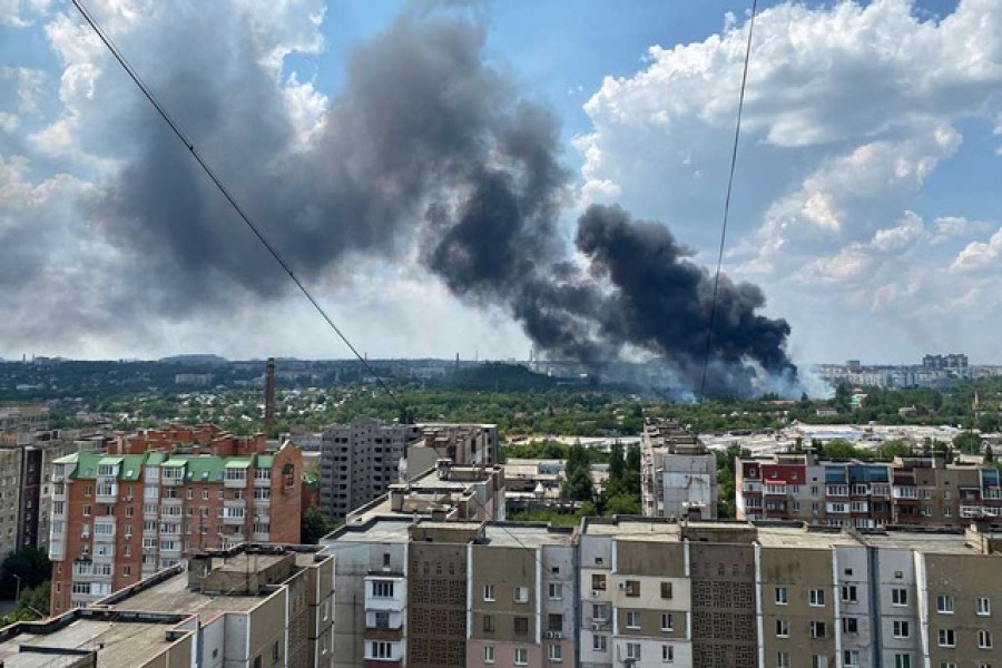 Smoke rises from the territory of an automotive centre following recent shelling during Ukraine-Russia conflict in Donetsk, Ukraine Jul 5, 2022. Reuters