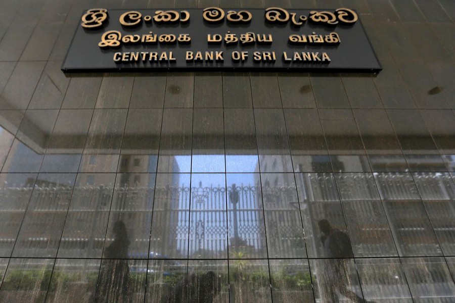 People walk past the main entrance of the Sri Lanka's Central Bank in Colombo, Sri Lanka on March 24, 2017 — Reuters/Files