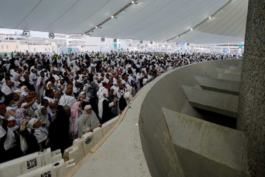 Muslim pilgrims cast their stones at a pillar symbolising the stoning of Satan during the annual Hajj pilgrimage in Mina, Saudi Arabia, July 9, 2022. Reuters