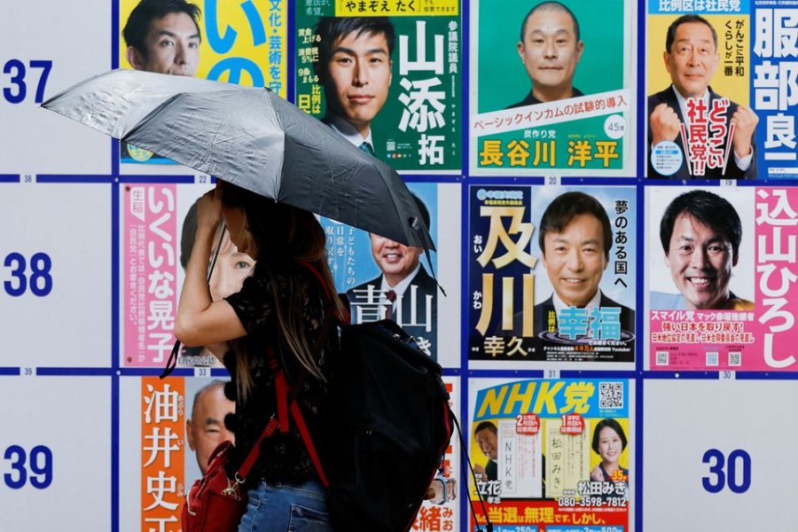 Candidates' posters for the Upper House election are displayed outside a polling station in Tokyo, Japan July 10, 2022. REUTERS/Issei Kato