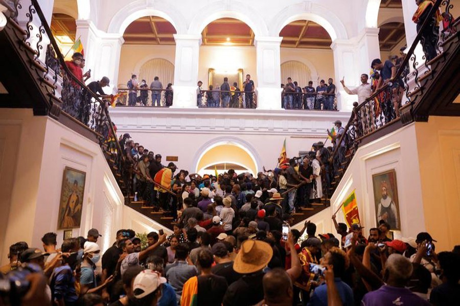 Demonstrators protest inside the President's House, after President Gotabaya Rajapaksa fled, amid the country's economic crisis, in Colombo, Sri Lanka on July 9, 2022 — Reuters photo