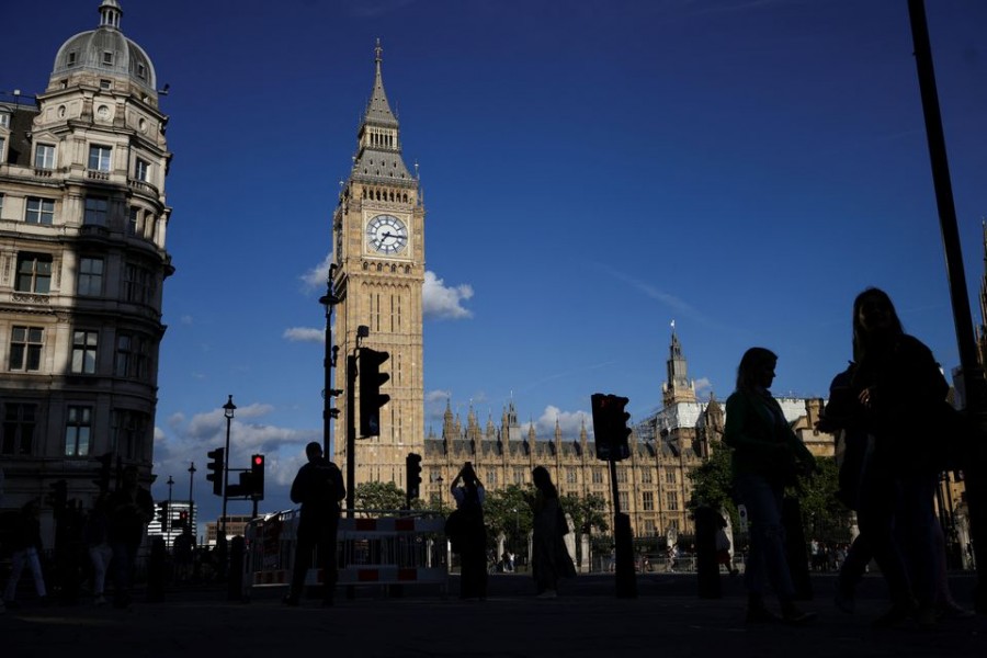 People walk near to the Houses of Parliament in London, Britain on July 05, 2022 — Reuters/Files