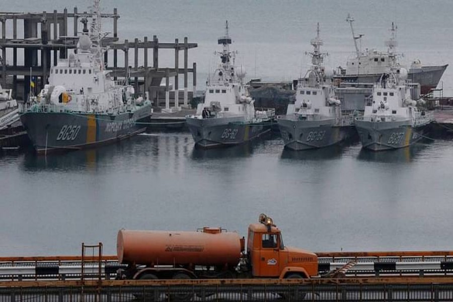 A tanker truck drives past Ukrainian border guard boats docked in the Black Sea port of Odessa, Ukraine November 26, 2018. REUTERS