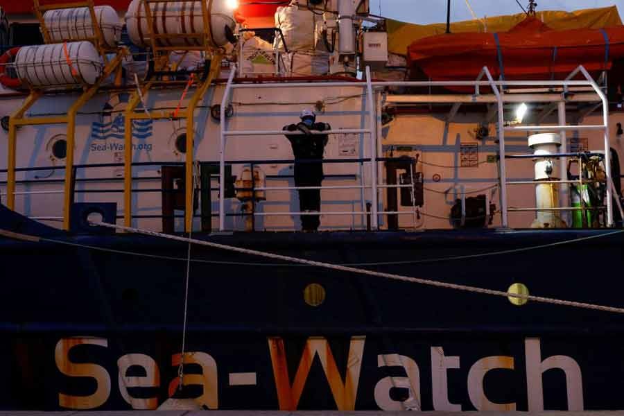 A crew member of the German NGO migrant rescue ship Sea-Watch 3 watching as an ill migrant is medically evacuated from the ship, while waiting for the last group of migrants to disembark from the ship in Trapani on the island of Sicily in Italy last year –Reuters file photo