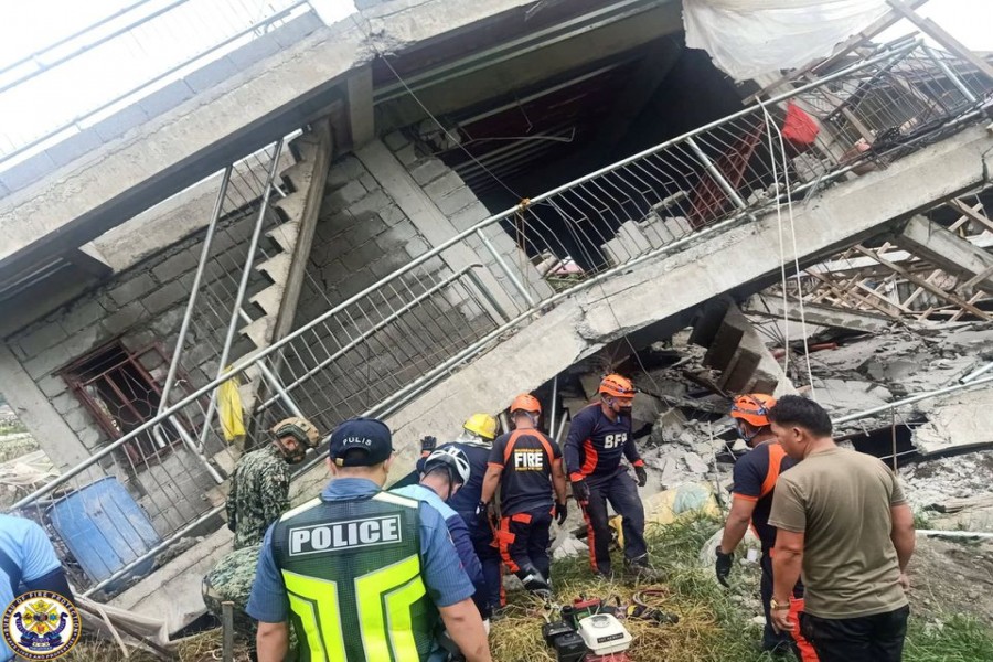 Emergency crew conduct rescue operations outside a building that collapsed during the earthquake, in La Trinidad, Benguet, Philippines July 27, 2022. Public Information Service-Bureau of Fire Protection /Handout via REUTERS