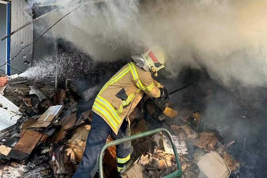 A firefighter works at a compound of a market destroyed by a Russian missile strike, as Russia's attack on Ukraine continues, in Bakhmut, Donetsk region, Ukraine July 30, 2022. Press service of the State Emergency Service of Ukraine/Handout via Reuters