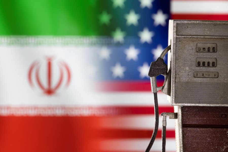 Model of petrol pump is seen in front of US and Iran flag colors in this illustration taken on March 25, 2022 — Reuters/Files