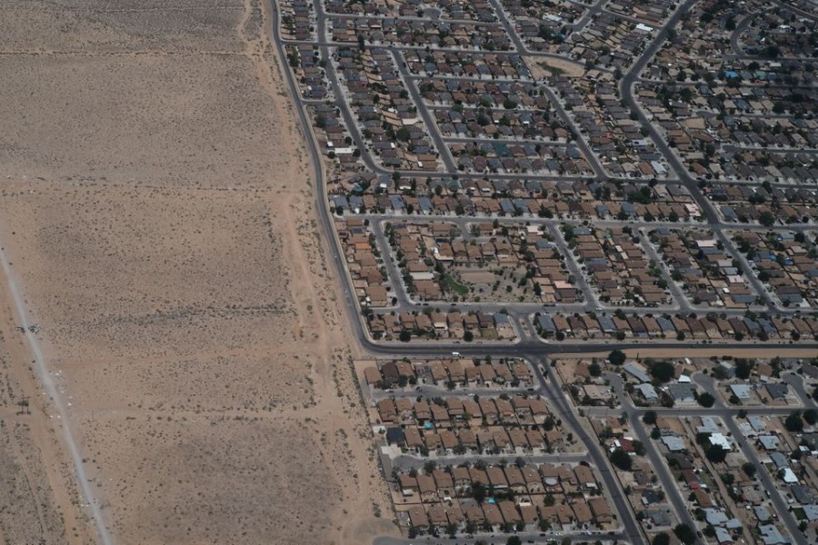 Houses reach the edge of the desert on the outskirts of Albuquerque, New Mexico, US, July 5, 2018. REUTERS/Brian Snyder