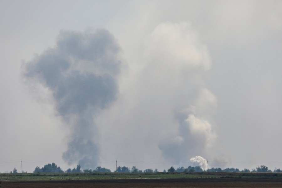 A view shows smoke rising above the area following an alleged explosion in the village of Mayskoye in the Dzhankoi district, Crimea, August 16, 2022. Reuters