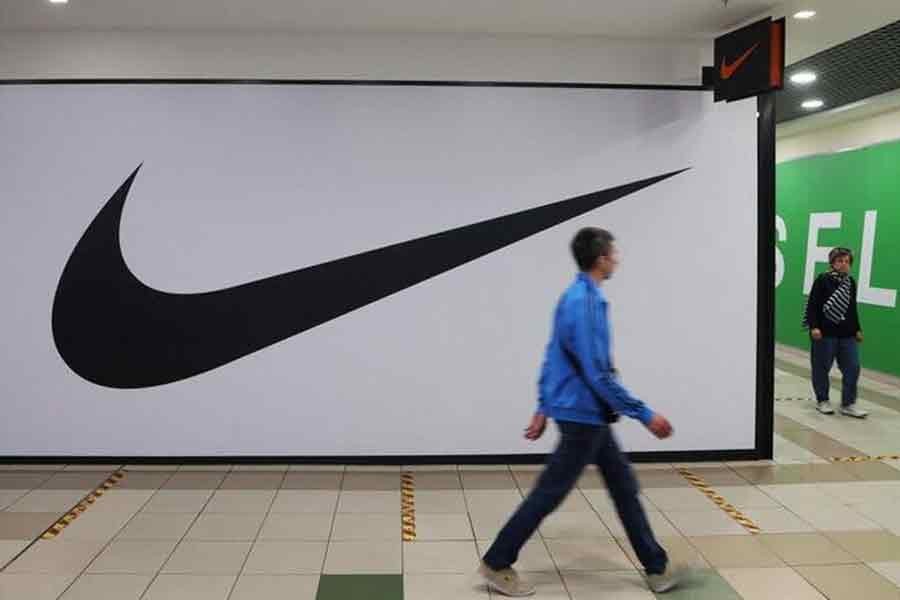 People walking past a closed store of the sporting goods retailer Nike at a shopping mall in Saint Petersburg in Russia on May 25 this year –Reuters file photo