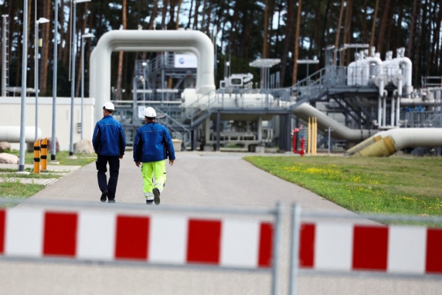 Workers are seen at a Nord Stream 1 pipeline site in Lubmin, Germany [File: Lisi Niesner/Reuters]